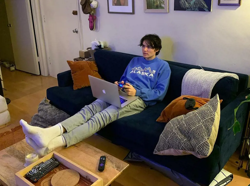 Michael Longfellow spends his days playing video games and having snacks on his couch