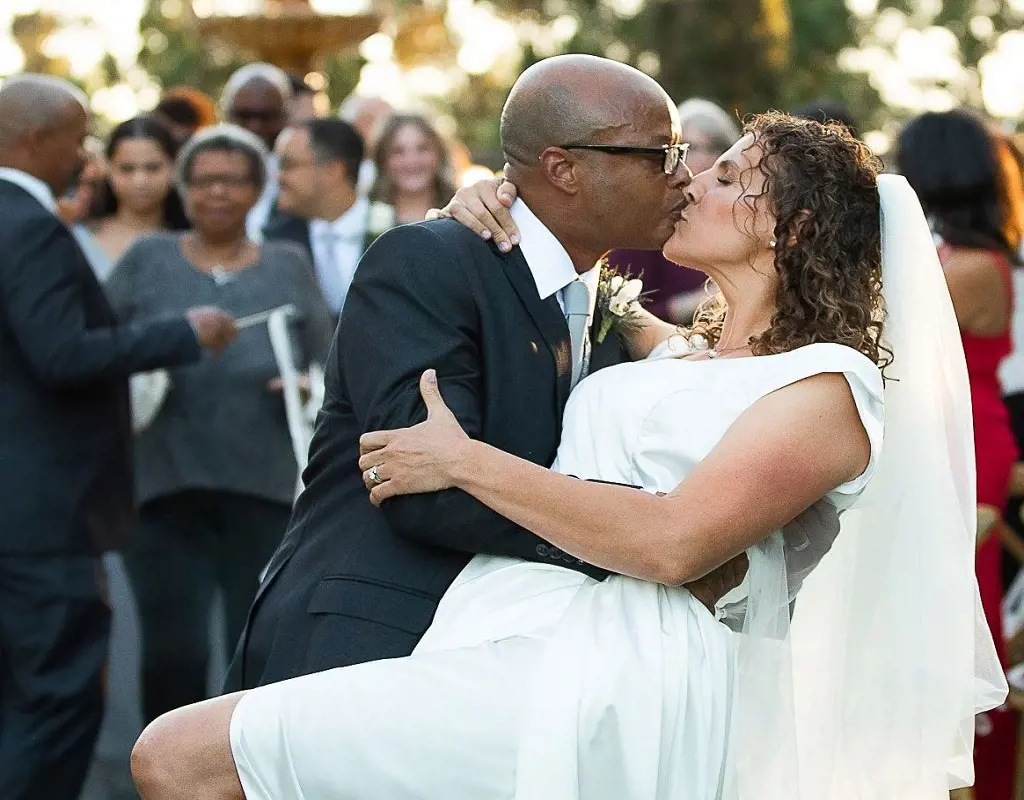 Diff'rent Strokes Alum Todd Bridges leans down carrying his wife's back to kiss her, They got married on Wednesday last week