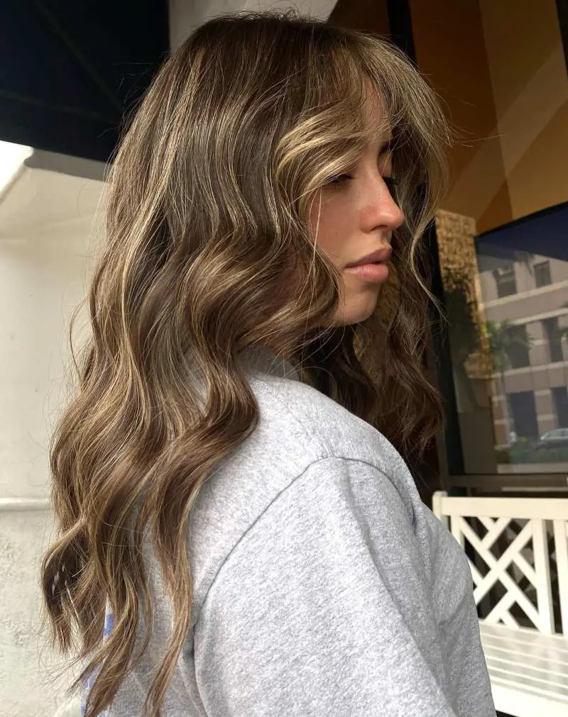 Sun kissed brunette balayage is the perfect way to add color and drama to brown hair