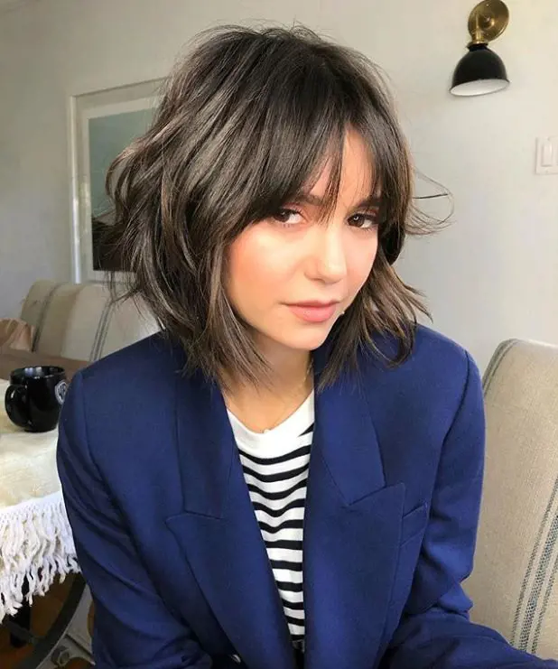 Nina Dobrev’s shag haircut looks fabulous and appealing.
