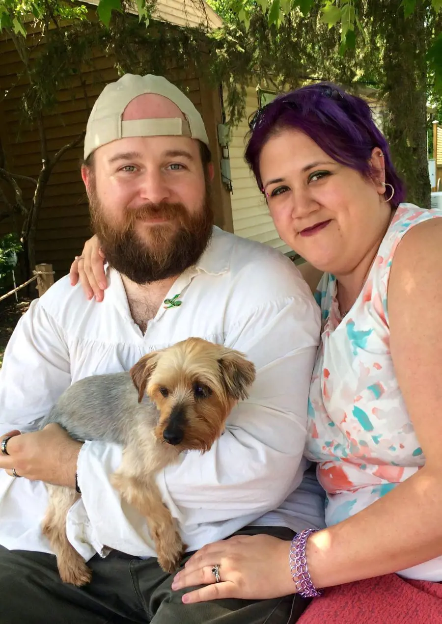 John pictured with his beloved wife, Kristine, and their cute dog in December 2018