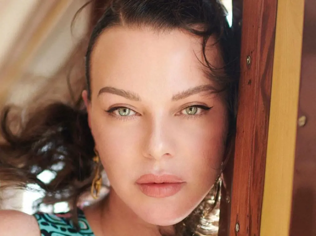 Debi Mazar on a vintage train in Puglia, Italy, wearing the Duro Olowu-designed dress. The picture was captured by photographers Luigi and Iango