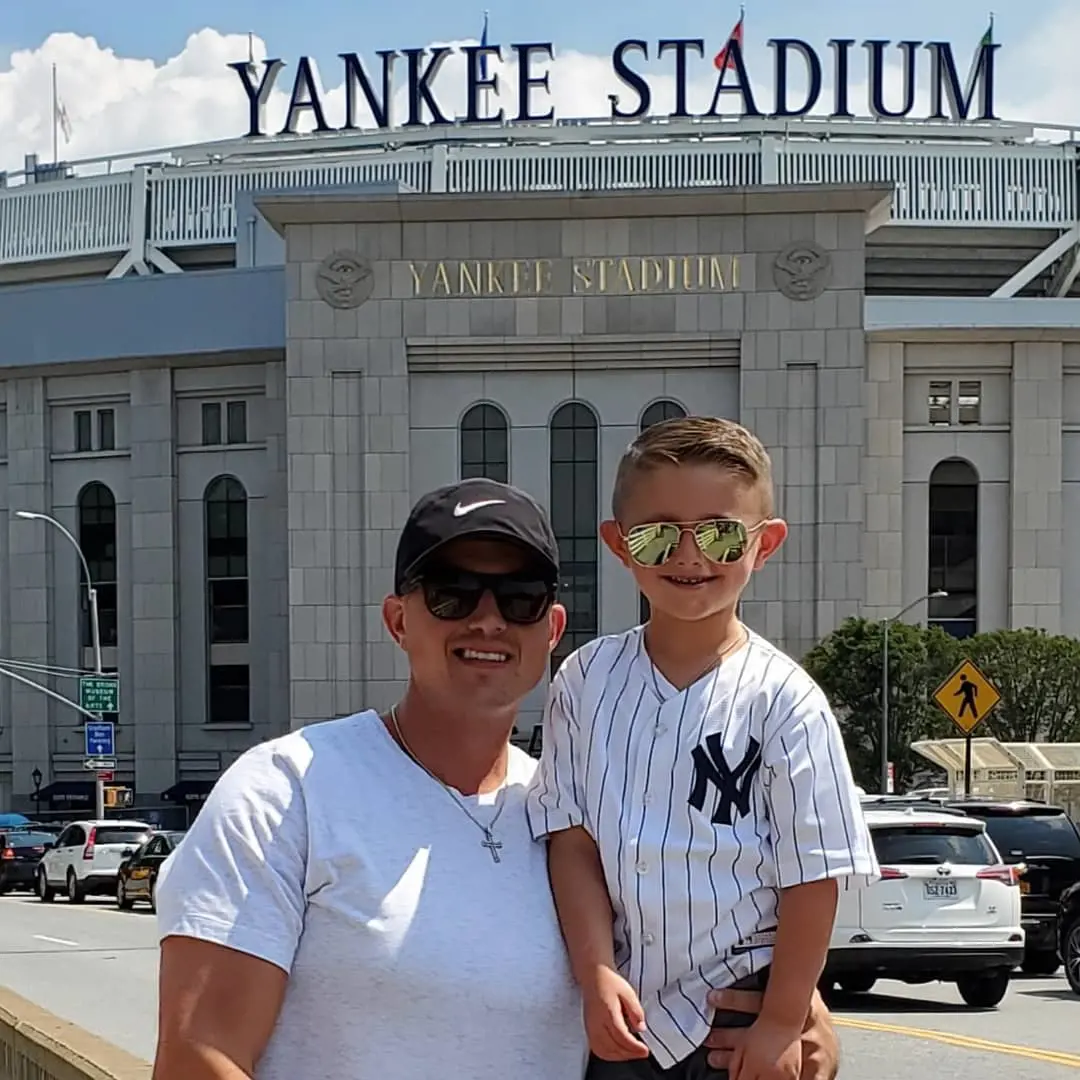 Nate with his son Dominic at a baseball match