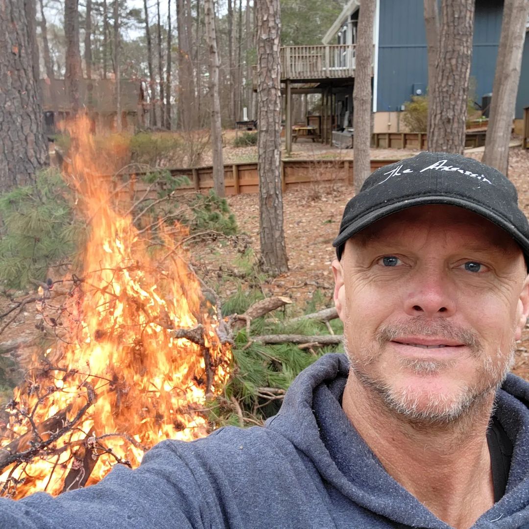 On January 30, 2023 Wes Harper posted a picture from his home burning some unused pine tree, he is also the owner of an IT company