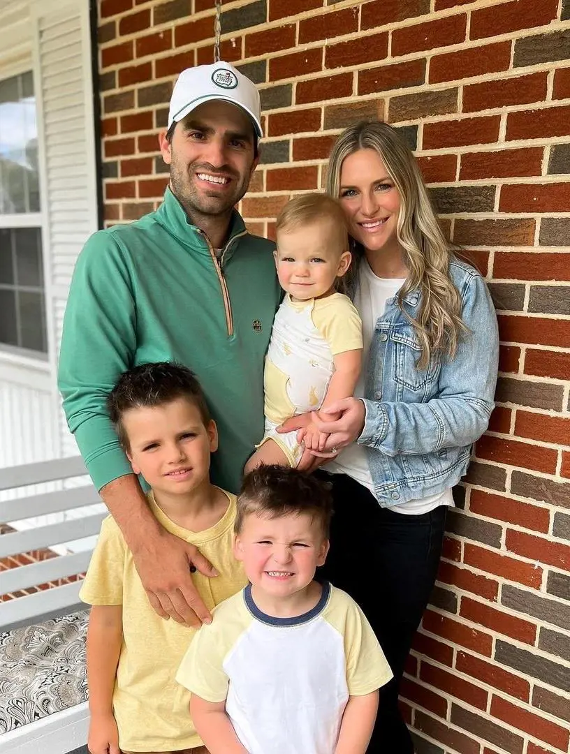 The country singer pictured with his beautiful wife, Whitney, and their three sons on Easter