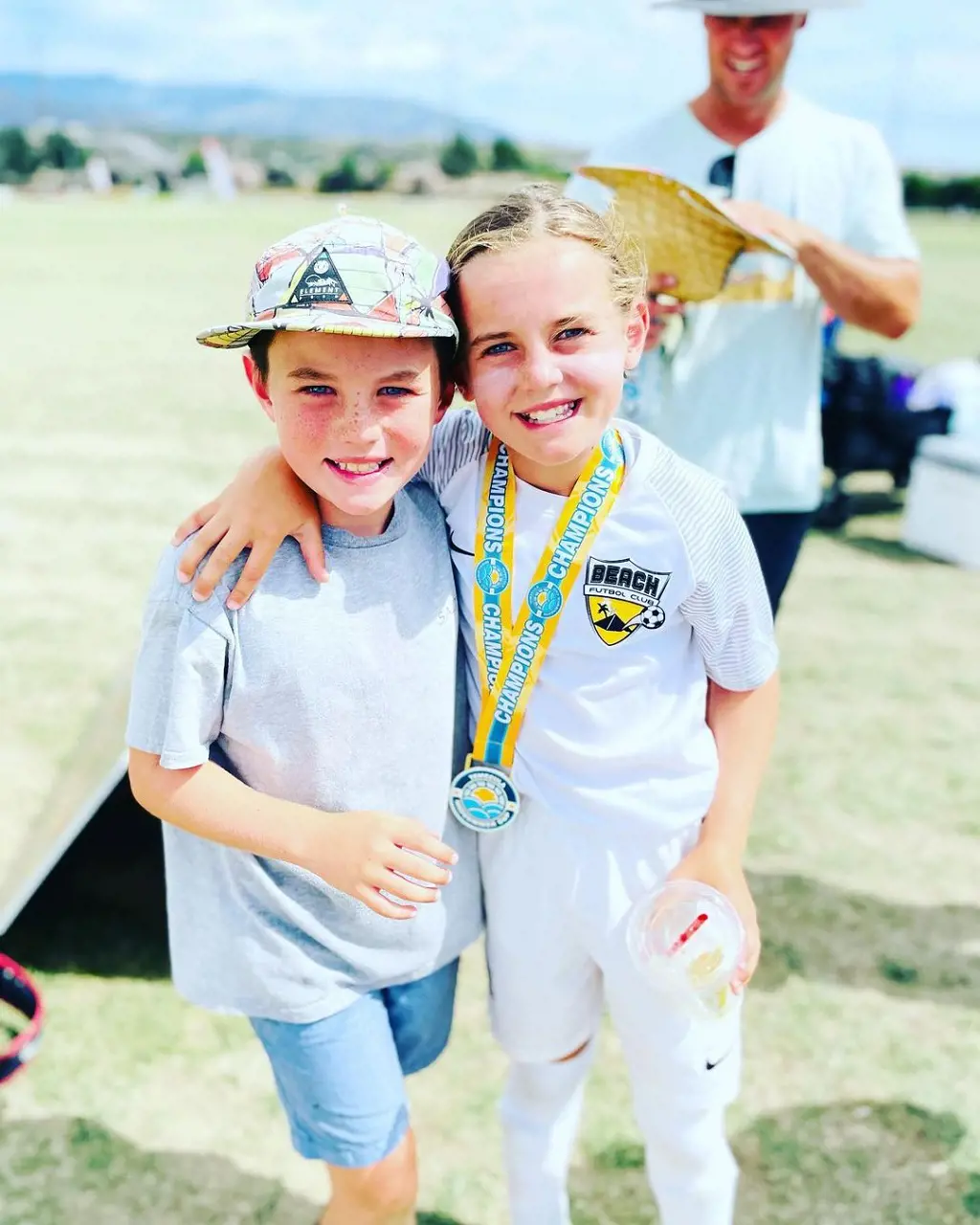 Mitch his son and daughter during their sport day in school