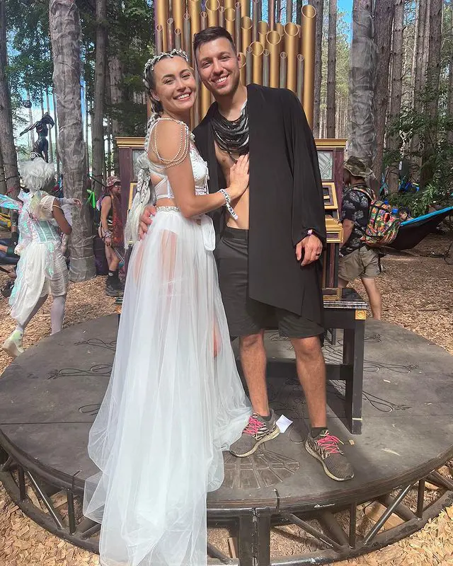 The pair on their wedding day; they tied the knot in Electric Forest music festival on June 24, 2022