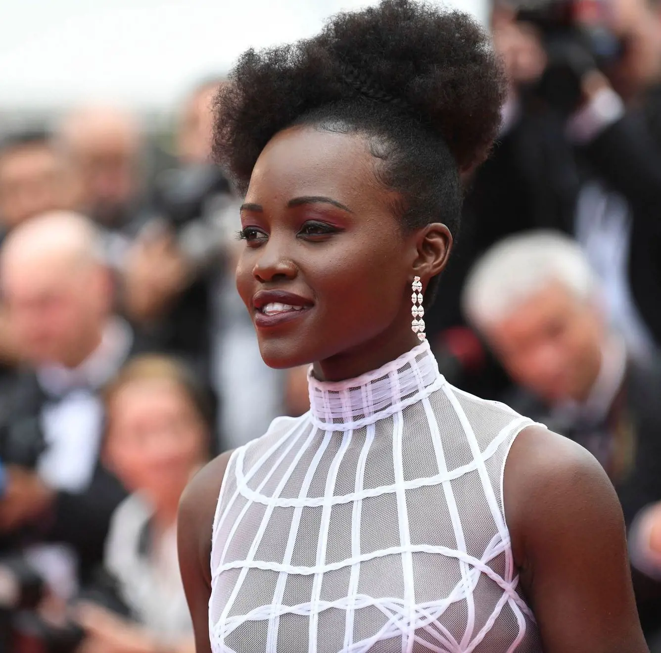 Lupita Nyongo donnes an Afro Puff for her Cannes film festival appearance